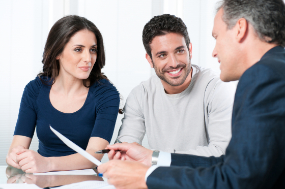 Photo of a couple meeting their lawyer to discuss a liferent trust in their Will