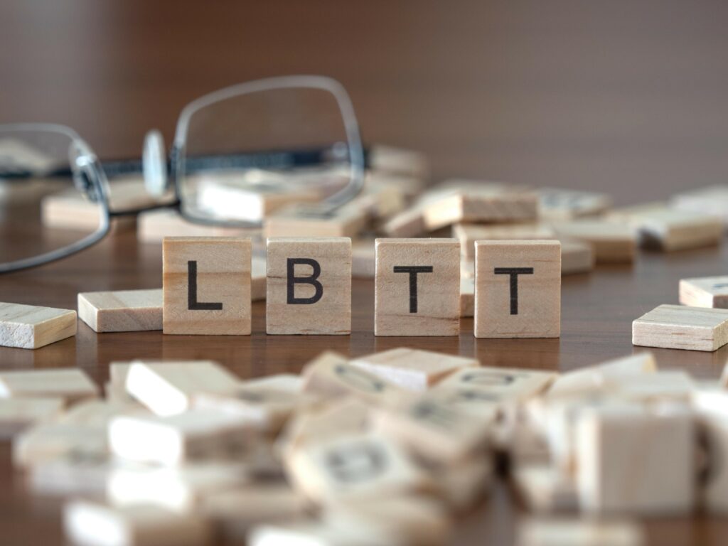 Wooden blocks spelling out LBTT from which Additional Dwelling Supplement is derived